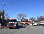 The celebration with the TFT train parked at the Wyckoff Station is in full swing with a fire truck on the left 